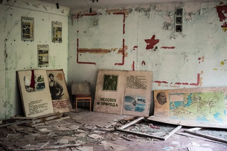 Pripyat, Ukraine - May 29, 2016: abandoned school room with pictures and debris on the floor in Pripyat, Chernobyl, Ukraineのeditorial素材