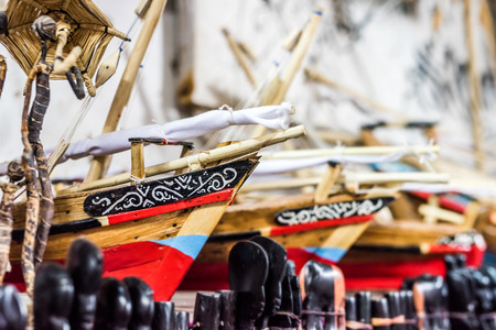 wooden handmade african toy boats at flea marketの写真素材