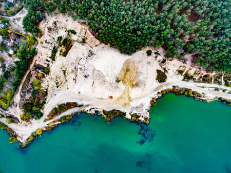 aerial shoot of a lake coast with sand mining, top viewの写真素材