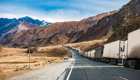 military road in Georgia with truks queueの写真素材