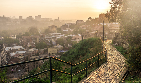 beautiful sunset view of Tbilisi from Narikala Fortress path with lighters, Georgiaの写真素材