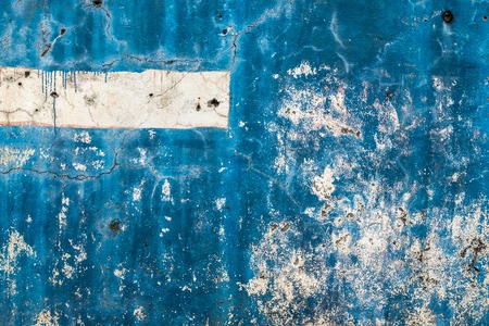 Textured background of old rough blue wallの写真素材