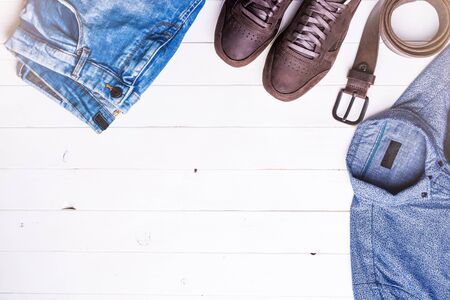 new male clothes on wooden background with text space, top viewの写真素材