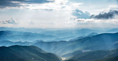 Mountain landscape with sun beams in ukrainian Carpathiaanの写真素材