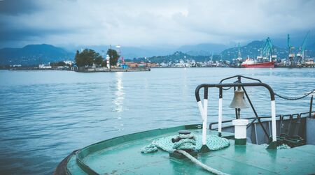 Bell on small shipboard with the picturesque view on the port of Batumi, Georgiaの写真素材