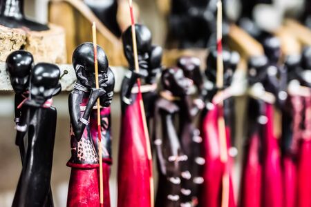 beautiful national tribal wooden ebony figures Masai at Zanzibar market, Africaの写真素材