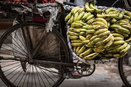 bananas on a bike on a street marketの写真素材