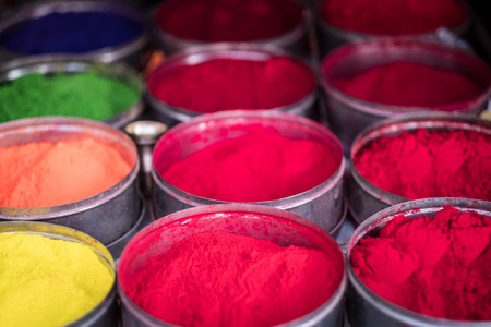 Colorful rangoli powder in bowls sold on Kathmandu street market, Nepalの写真素材