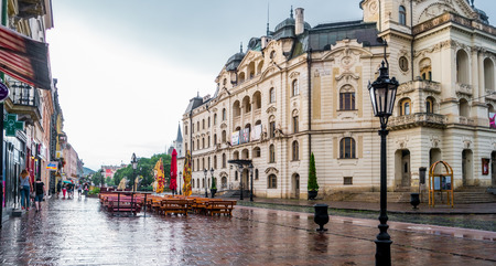 Kosice, Slovakia - July 09, 2015: central street near National Theatre in Kosice wet after rain