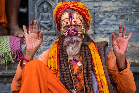 Kathmandu, Nepal - 06 October 2017: sadhu in colourful clothes and painted face in Kathmandu city, Nepalのeditorial素材