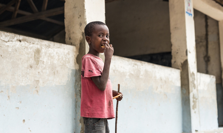 Zanzibar, Tanzania - July, 15, 2016: Editorial use - cute little african boy on a street in Zanzibar, Africaのeditorial素材