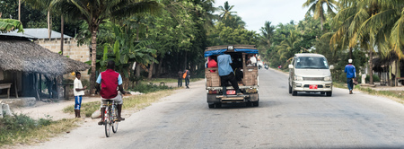 Zanzibar, Tanzania - July 14, 2016: Trucks and bicycles on the streets of Zanzibar, Tanzania, poor life of local peopleのeditorial素材