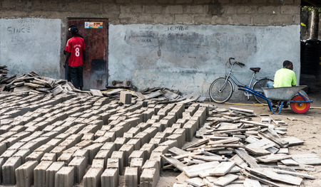 Zanzibar, Tanzania - July 14, 2016: Local folks resting during their break from working and making bricks, Zanzibar, Tanzaniaのeditorial素材