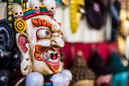Traditional red Bhairav hindu mask hanging at souvenir marketの写真素材