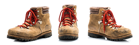 Set of old leather mountain shoes isolated on white backgroundの写真素材
