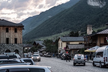 Mestia, Georgia - 31 August 2017: Typical building in Mestia town with wooden and stone facade on the street close to mountains, Gergiaのeditorial素材
