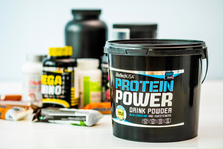 Kharkiv, Ukraine - 26 July 2018 : Different food supplement in colorful capacities on the white tableのeditorial素材