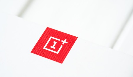 Khakiv, Ukraine - 14 August 2018: Red square logotype of smartphone OnePlus 6 with white background