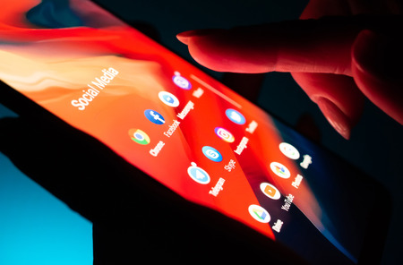 Kharkiv, Ukraine - 16 November 2018: close up girl hand using smartphone with social media apps on...