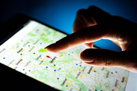 Kharkiv, Ukraine - 12 November 2018: close up girl hand using tablet with Google map app on the...