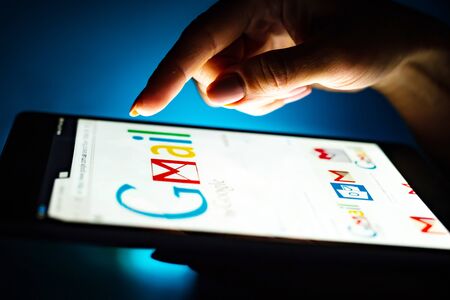 Kharkiv, Ukraine - 12 November 2018: close up girl hand using tablet with Google gmail app on the...