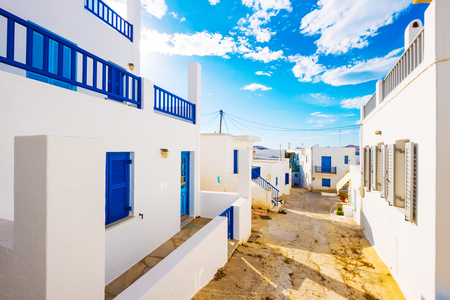 Classic greek street at bright day under blue skyの写真素材