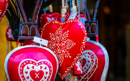 Closeup view of red jewelry hearts with white patternsの写真素材