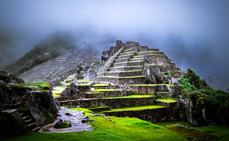 Amazing view of breathtaking Machu picchu temple covered with fogの写真素材