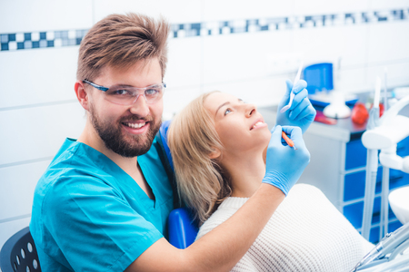 Patient and dentist in the dental officeの写真素材
