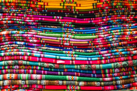 Stack of colorful blankets with different weavesの写真素材