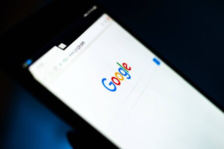 Kharkiv, Ukraine - 12 November 2018: close up tablet with Google on the screen with a dark backgroundのeditorial素材