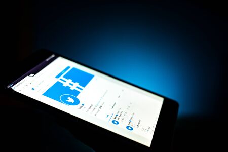 Kharkiv, Ukraine - 12 November 2018: close up tablet with Twitter app on the screen with a dark...