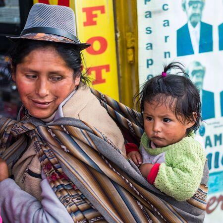 Cusco, Peru - October 11, 2018: woman with baby on a Cusco street in Peruのeditorial素材
