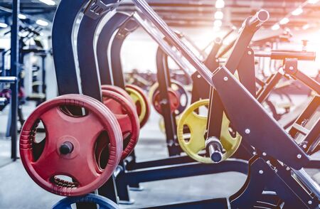 leg trainer equipments and weights in a gym