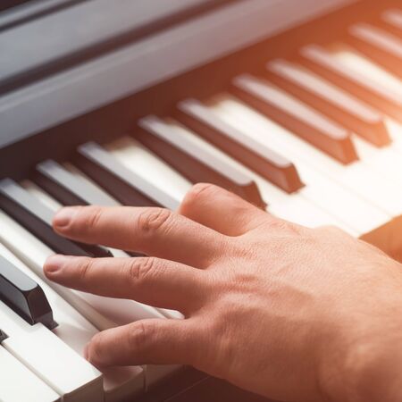 Man playing piano close up