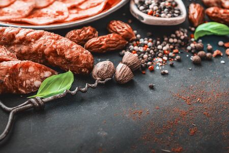 Composition of sausages, spices in spoonの写真素材