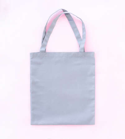 Light blank shopper bag on pink background