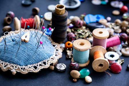 Close up of sewing pins, retro threads and beads assortmentの写真素材