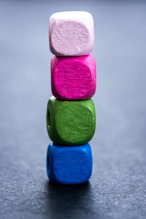 Stack of bright wooden beads on gray backgroundの写真素材