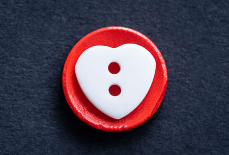 Top view of heart shaped sewing button macroの写真素材