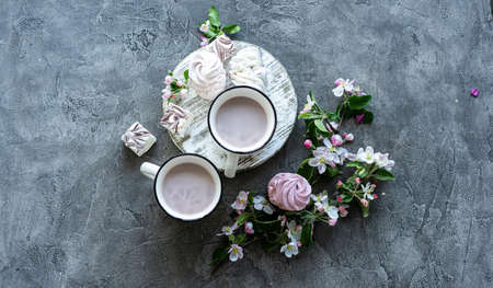 Cups with cocoa and marshmallows, top view