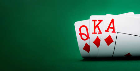 playing cards on a green table casino with copy space