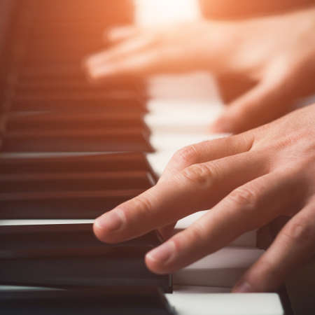 Man playing piano close upの写真素材