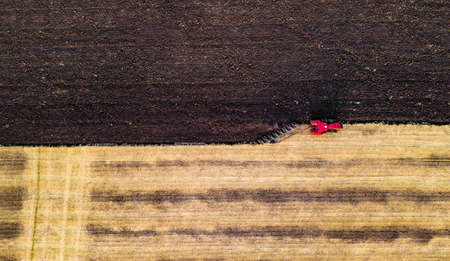 Aerial view of collecting harvest by machinery