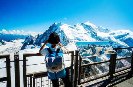 Shamoni Rrance - 25 August 2019: Tourist looking on beautiful alpine mountains from viewpointのeditorial素材