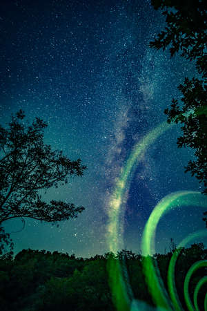 Green neon lights on nature backgroundの写真素材