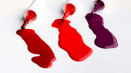 Shiny nail polish drops sample isolated on whiteの写真素材