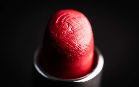 Beautiful red lipstick on black backgroundの写真素材