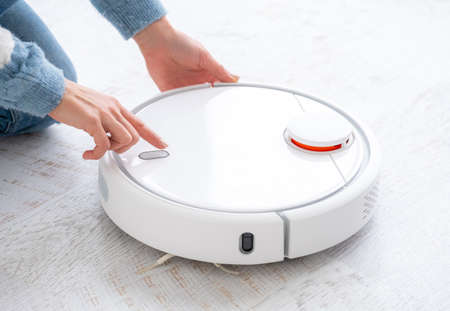 Switching on robotic vacuum cleaner in light room
