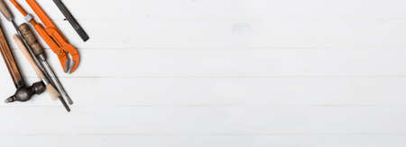 set of instruments with text space on white wooden background with copyspace
